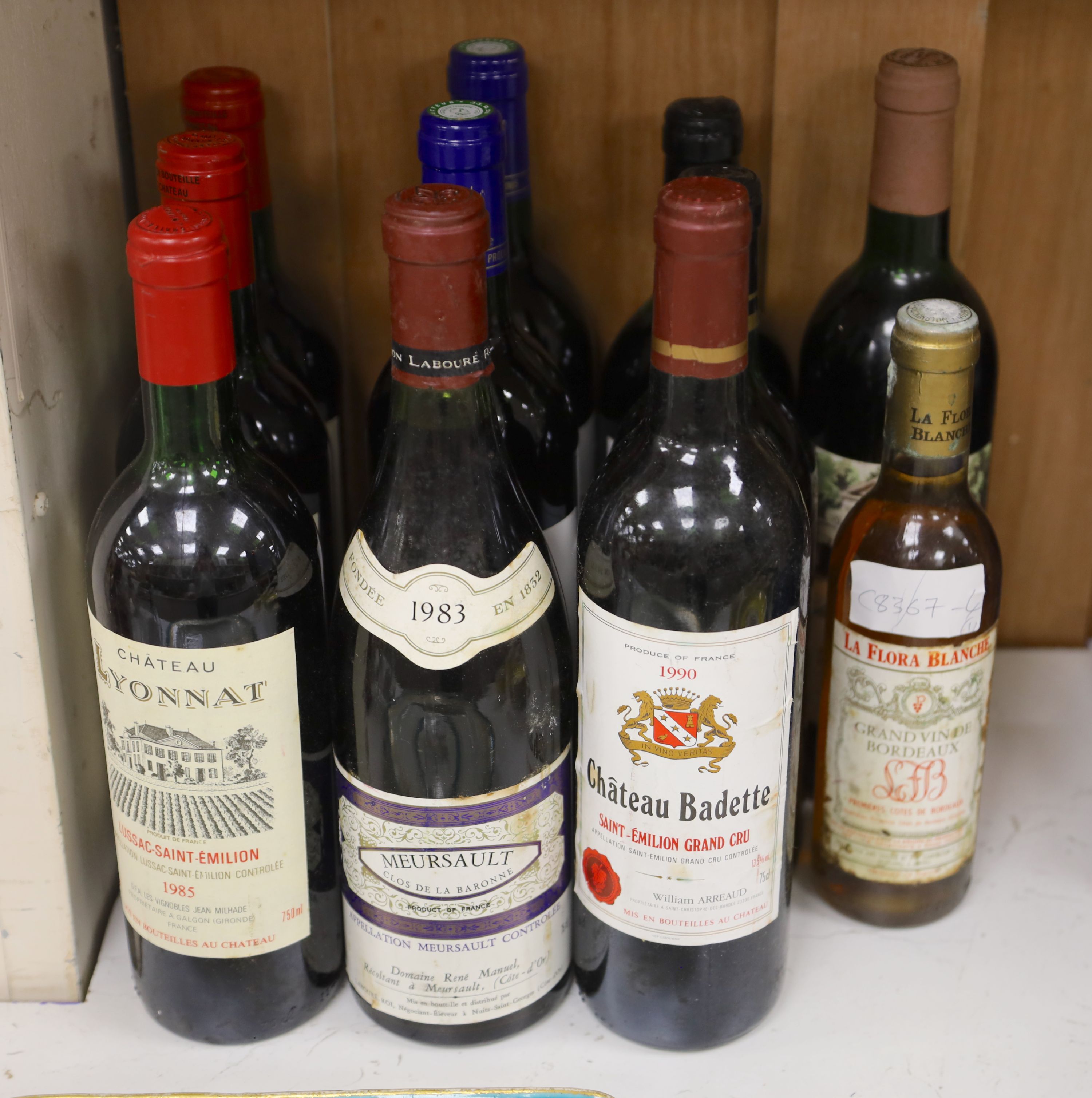 Ten assorted red Bordeaux wines and a white half bottle.